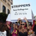 Amber-Rose-marching-at-Slut-Walk-L.A.-holling-up-a-sign-that-says-strippers-have-feelings-too