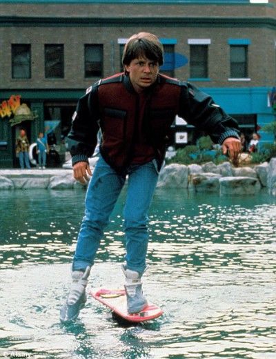 Mart-McFly-is-floating-over-water-on-a-futuristic-skateboard