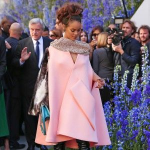 Rihanna-wearing-a-pink-cape-dress-which-has-one-mink-sleeve