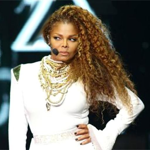 Janet-Jackson-with-one-hand-on-hip-looking-angry-on-stage-2015