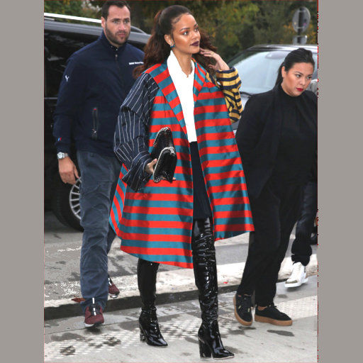 Rihanna- visiting-the-Eiffel-Tower-in=a=multi=striped=jacket-during-Paris-Fashion-Week-2015